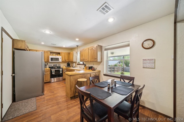 dining area featuring hardwood / wood-style flooring