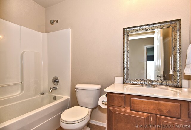 full bathroom featuring vanity, shower / washtub combination, and toilet