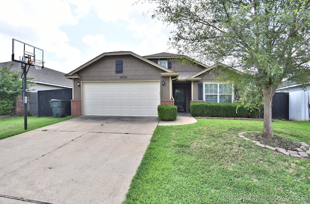 view of front of home featuring a front lawn and a garage