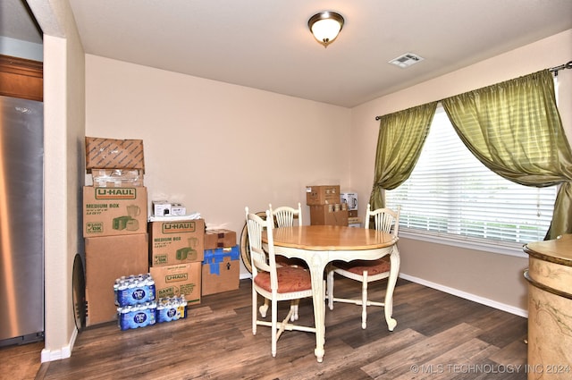 dining room with dark hardwood / wood-style flooring