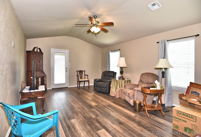 living area with dark wood-type flooring, ceiling fan, lofted ceiling, and plenty of natural light