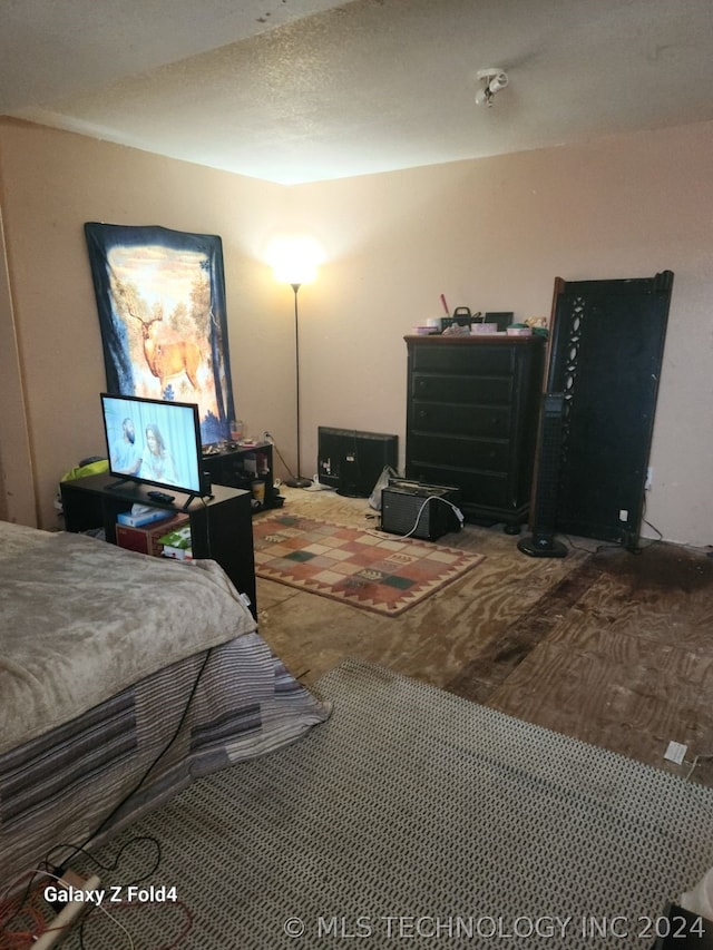 bedroom featuring a textured ceiling