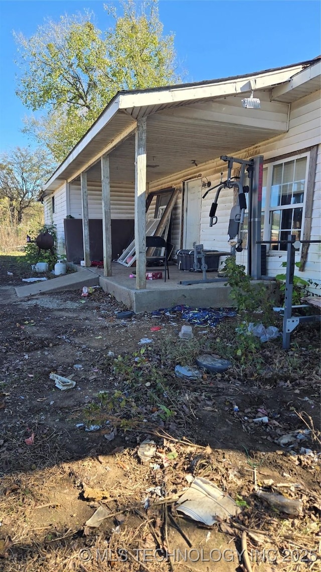 view of side of home featuring a patio area