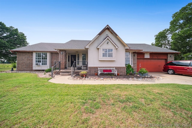 view of front of property with a garage and a front yard