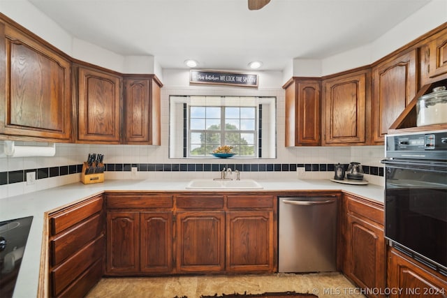 kitchen with stovetop, sink, oven, dishwasher, and backsplash