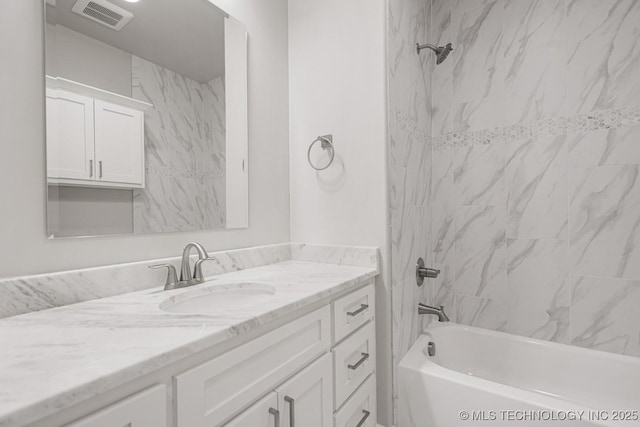 bathroom featuring visible vents, vanity, and shower / bathtub combination