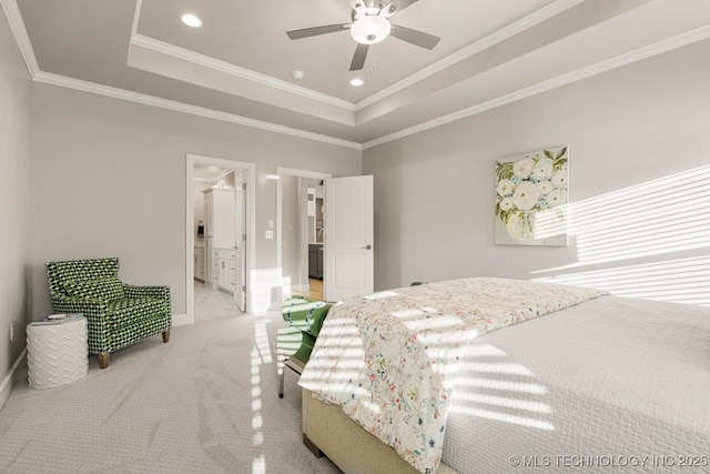 bedroom with ornamental molding, a tray ceiling, recessed lighting, and light colored carpet