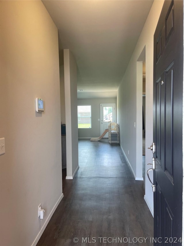 corridor featuring dark wood-type flooring