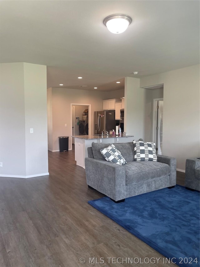 living room with dark hardwood / wood-style floors