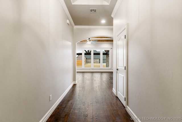 corridor with dark hardwood / wood-style floors and crown molding