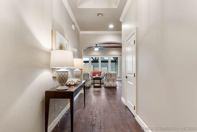 hallway with crown molding and dark hardwood / wood-style floors