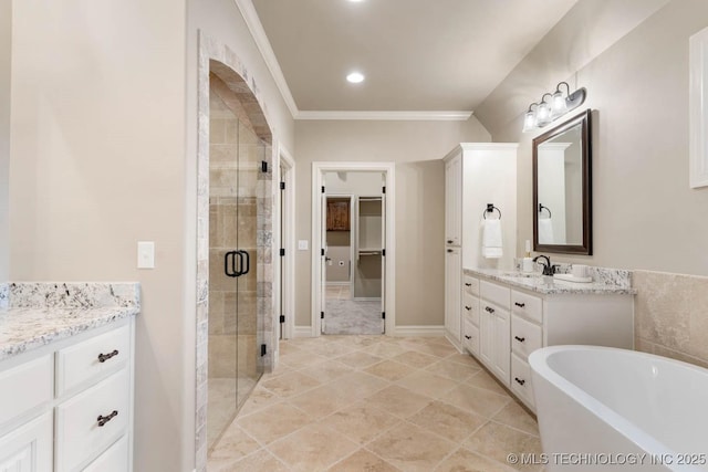 bathroom with vanity, ornamental molding, and shower with separate bathtub