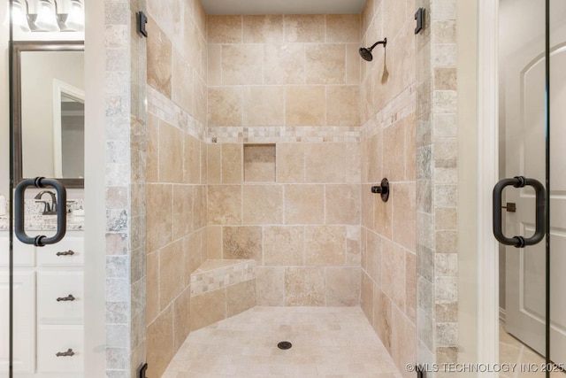 bathroom featuring a shower with door