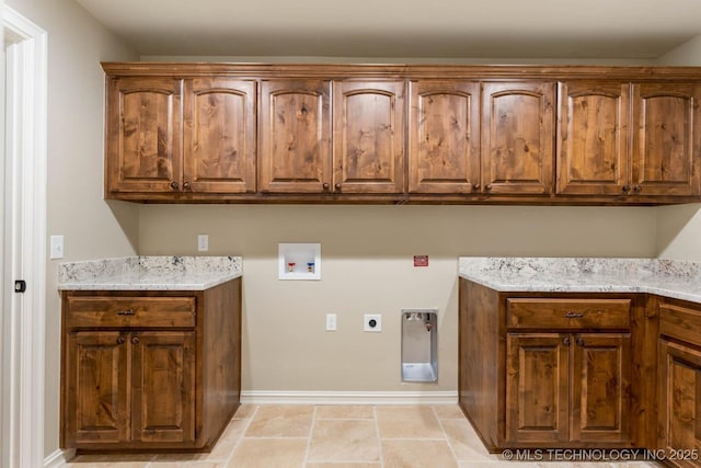 laundry area with cabinets, washer hookup, and electric dryer hookup