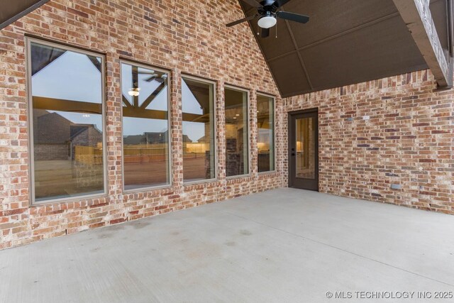 view of patio featuring ceiling fan