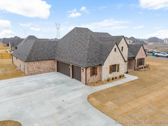 view of front of property with a garage and a front yard