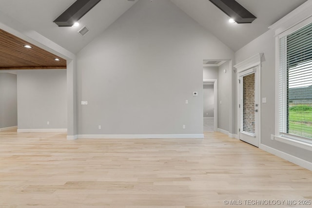 spare room featuring high vaulted ceiling, light wood finished floors, baseboards, and recessed lighting