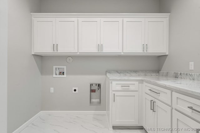 laundry area featuring washer hookup, cabinet space, electric dryer hookup, baseboards, and hookup for a gas dryer