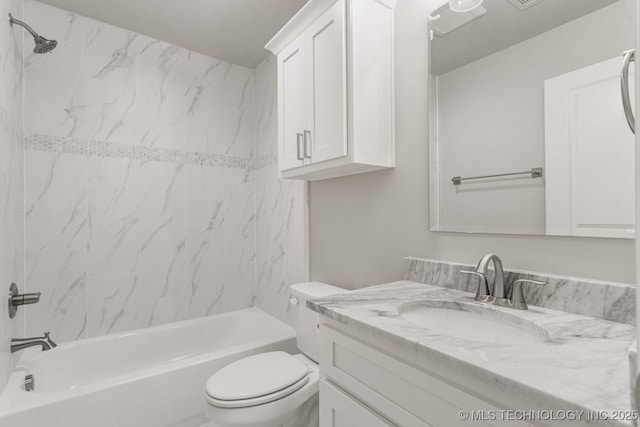 full bathroom featuring toilet, vanity, and bathing tub / shower combination