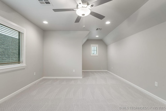 bonus room featuring light colored carpet, baseboards, ceiling fan, vaulted ceiling, and recessed lighting