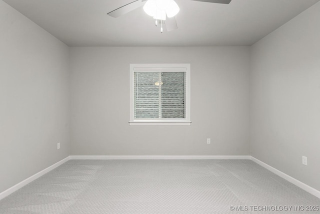 unfurnished room with light carpet, ceiling fan, and baseboards