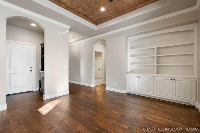 unfurnished living room featuring dark wood-type flooring, wooden ceiling, a tray ceiling, and crown molding