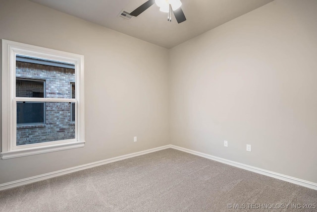 unfurnished room featuring ceiling fan and carpet floors