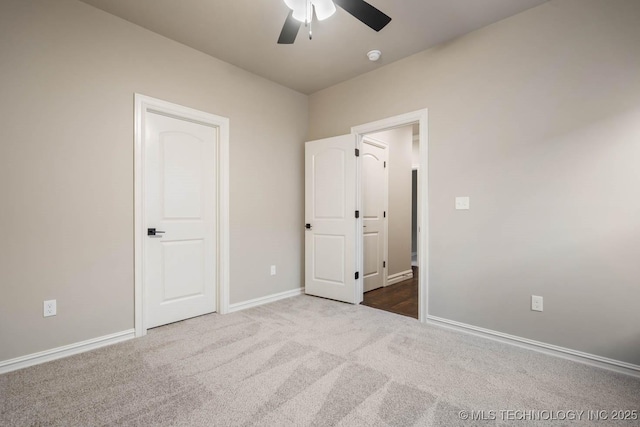 unfurnished bedroom with ceiling fan and carpet flooring