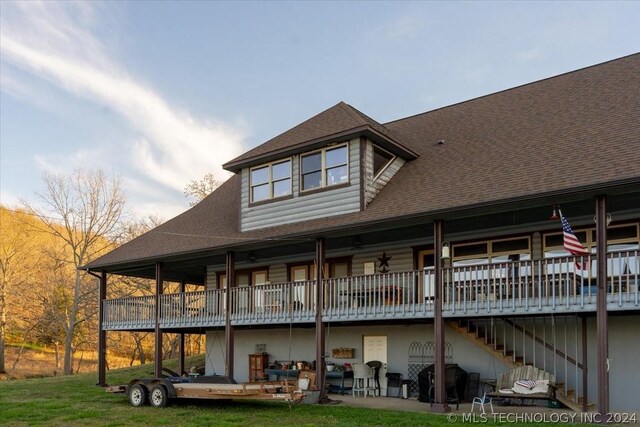 9212 N 447th Rd, Spavinaw, OK 74366 - rear view of house with stairs, a yard, and roof with shingles