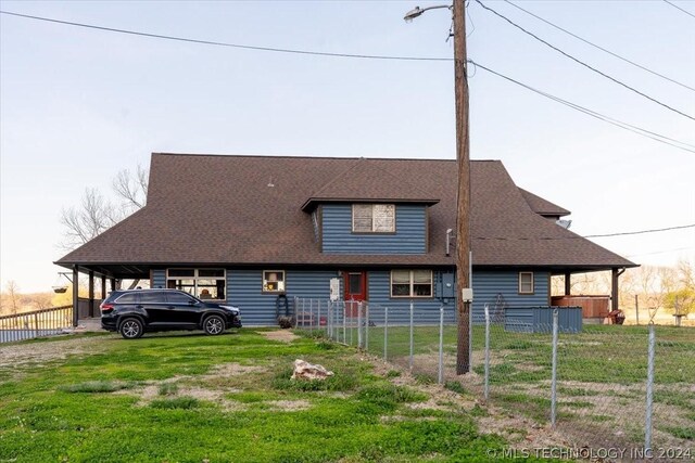 9212 N 447th Rd, Spavinaw, OK 74366 - country-style home featuring a shingled roof, fence, a front lawn, and a carport