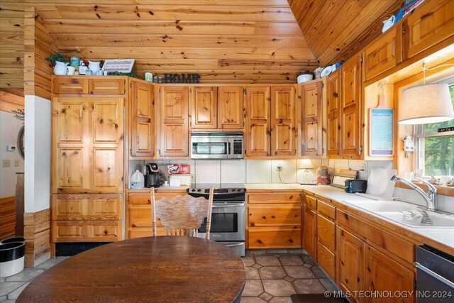 9212 N 447th Rd, Spavinaw, OK 74366 - kitchen with lofted ceiling, appliances with stainless steel finishes, wood ceiling, a sink, and tile patterned floors