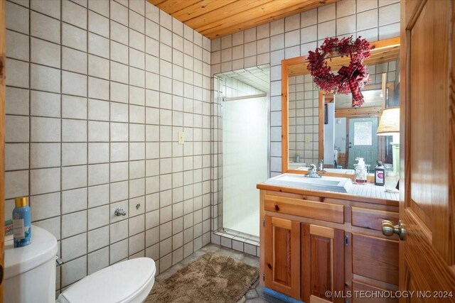 9212 N 447th Rd, Spavinaw, OK 74366 - full bathroom with a stall shower, tile walls, toilet, and vanity