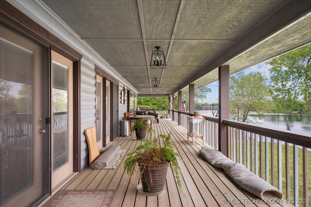9212 N 447th Rd, Spavinaw, OK 74366 - wooden deck with a water view