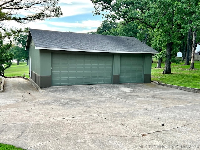 garage with a yard