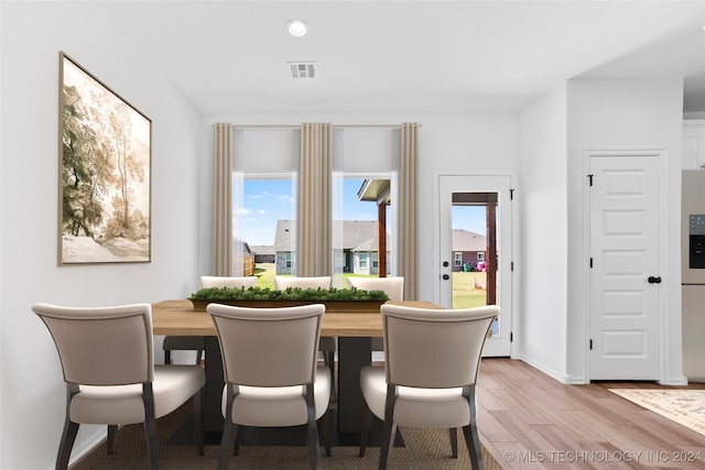 dining area with light hardwood / wood-style flooring