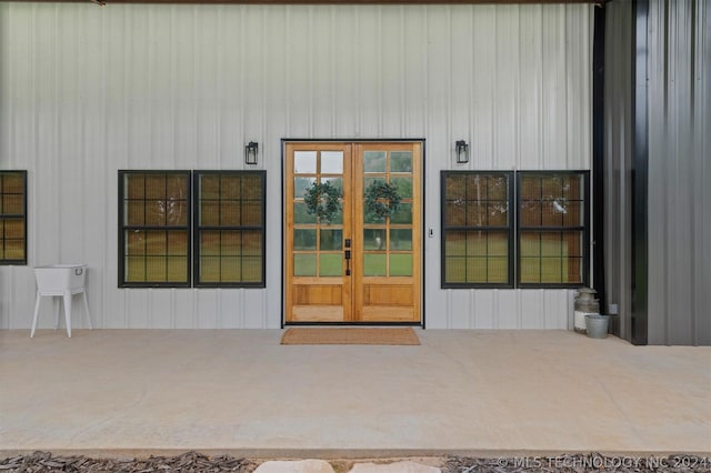 view of exterior entry featuring french doors