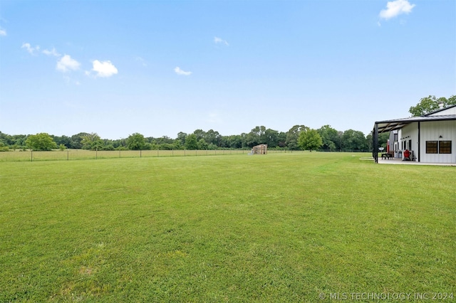 view of yard with a rural view