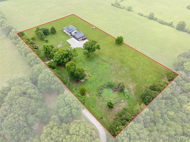 birds eye view of property with a rural view