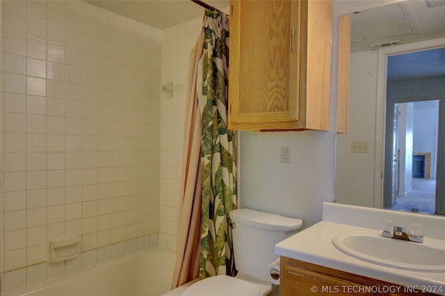 full bathroom featuring vanity, toilet, and shower / tub combo