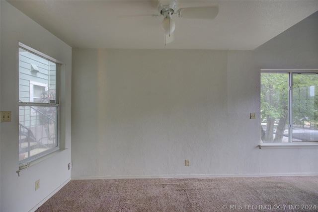 carpeted empty room with ceiling fan