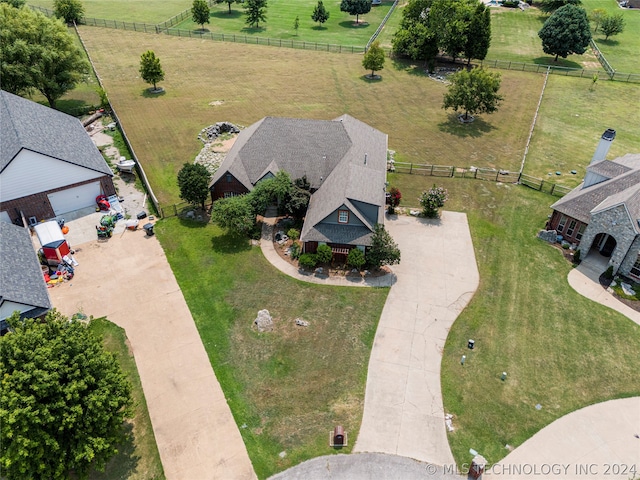 birds eye view of property with a rural view