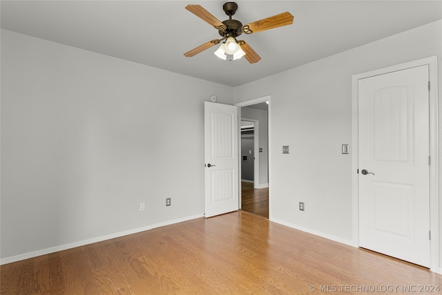 unfurnished room featuring ceiling fan and wood-type flooring