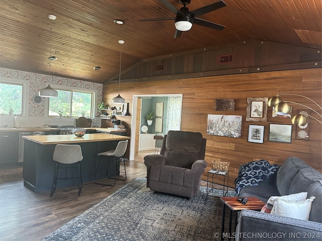 living room featuring wood ceiling, dark hardwood / wood-style floors, and lofted ceiling