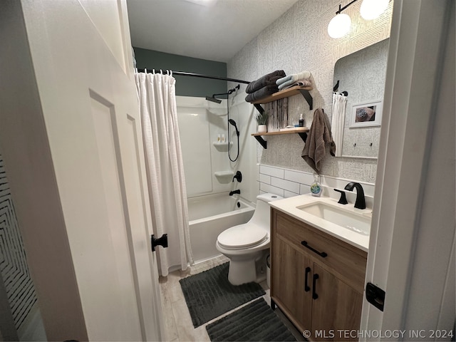 full bathroom with shower / bath combination with curtain, vanity, and toilet