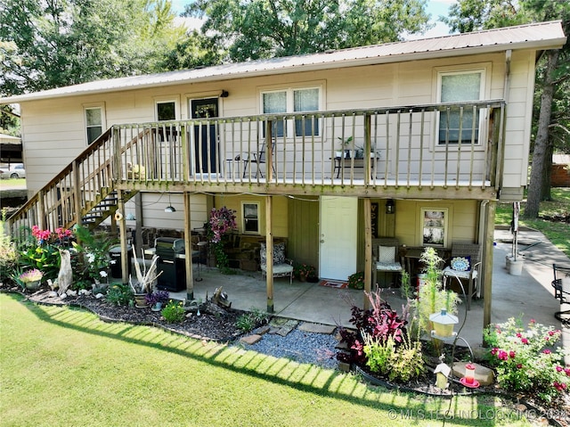 back of house with a yard and a patio area