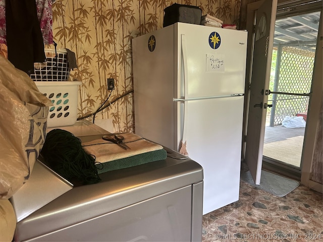 washroom featuring washer / clothes dryer and tile patterned flooring