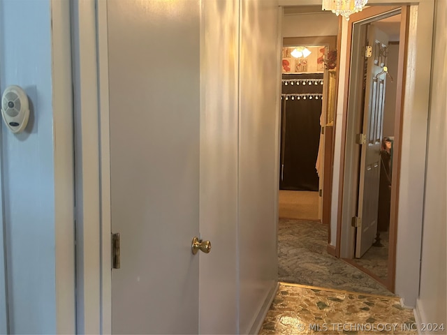 corridor featuring carpet flooring