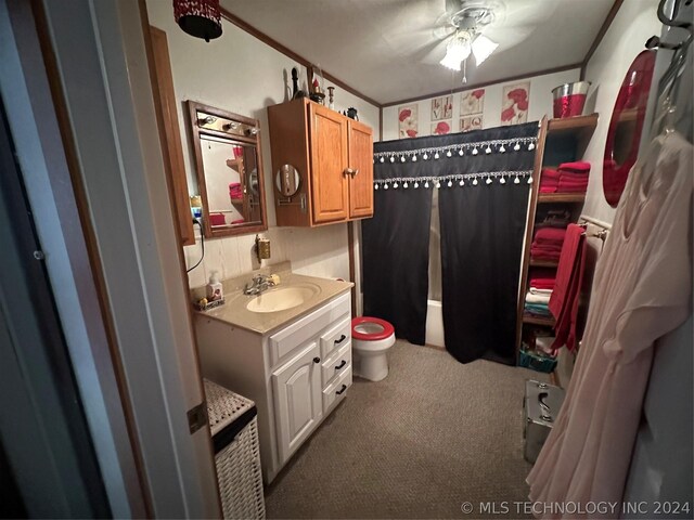 bathroom featuring ornamental molding, toilet, vanity, and ceiling fan