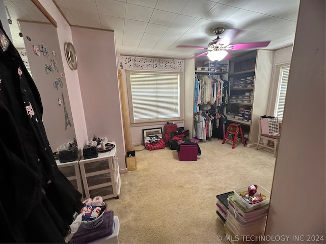 playroom featuring ceiling fan and carpet flooring