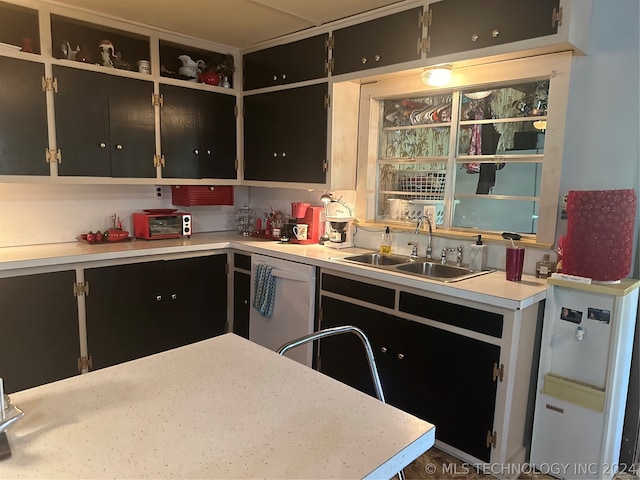 kitchen featuring white refrigerator, sink, and stainless steel dishwasher